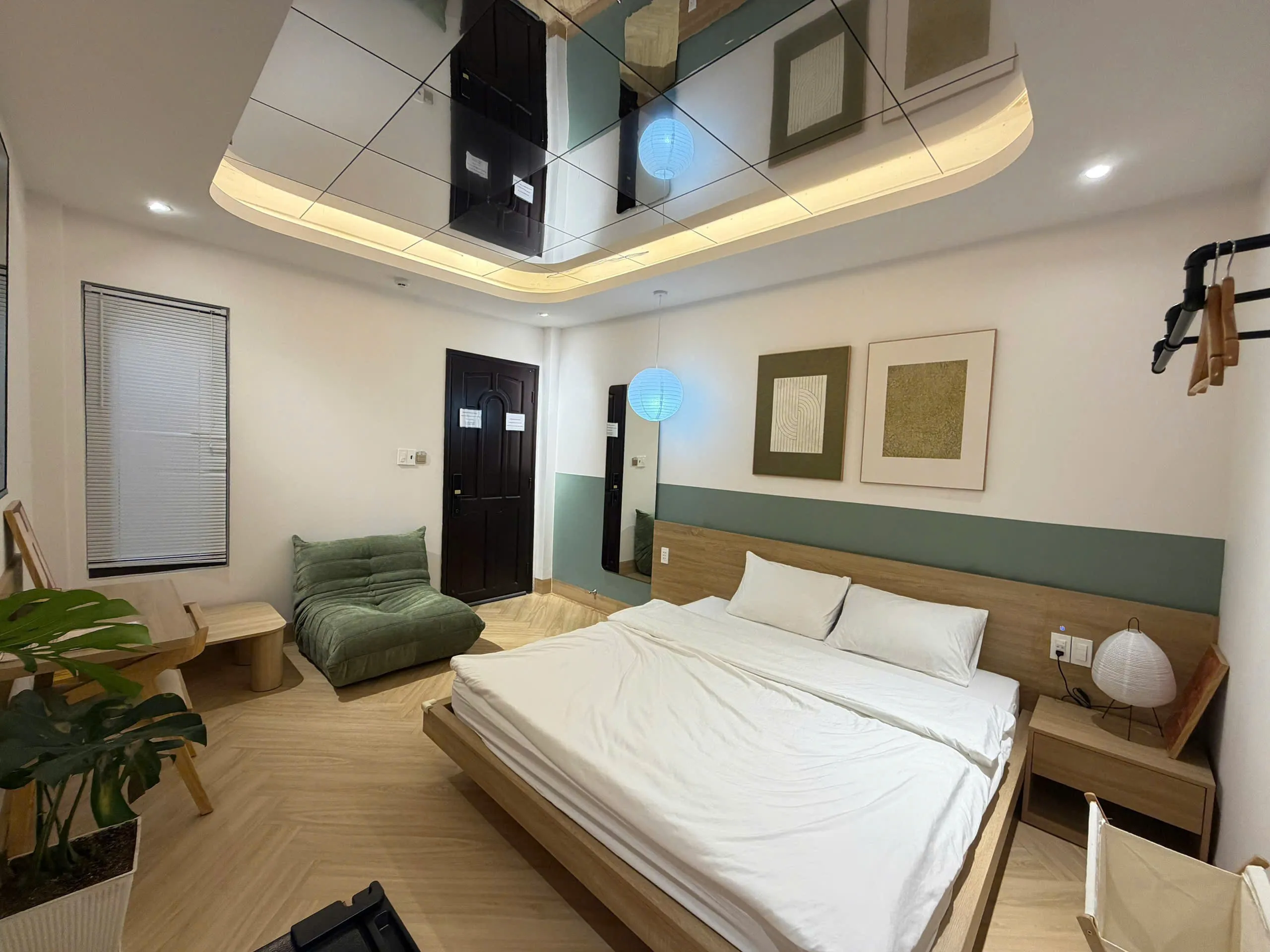 Cozy room with unique ceiling design at De Seconde Home Tan Binh